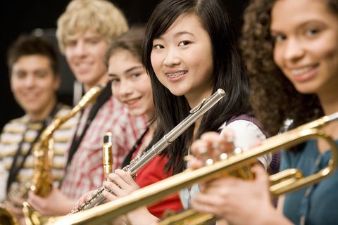 Students playing band instruments: Band