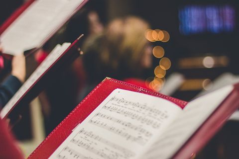 Choir music folders open during a performance: Choir